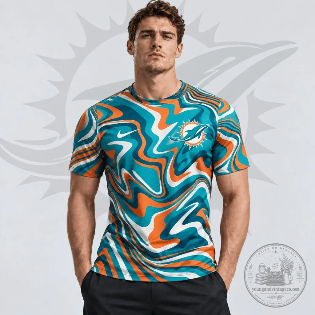 Miami Dolphins NFL Team Crest Abstract Wave All Over Print T-Shirt Miami Dolphins NFL Team Crest Abstract Wave All Over Print T-Shirt